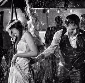 Bride and Groom having fun in the rain