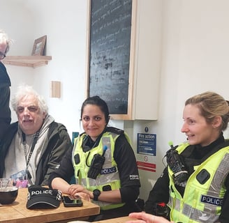 Members of the public with community policing team in coffee shop