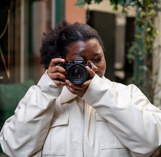a black woman taking a self portrait of herself