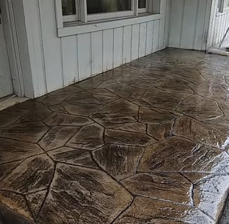 A polished concrete patio area that is finished and shining.  It has just been coated and sealed.