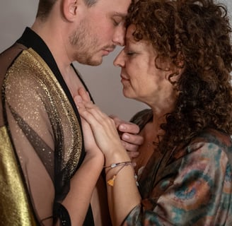 a man and woman holding hands in an embrace
