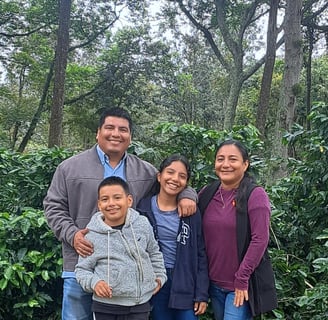 a family posing for a photo in a park