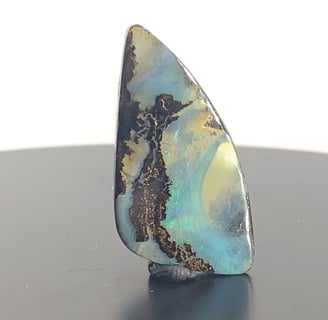 Stunning blues and greens amongst Ironstone. Queensland Boulder Opal from Australia.