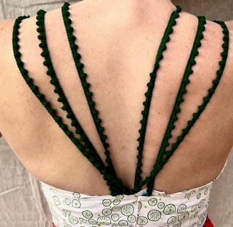 Back straps of green, white, and red sundress