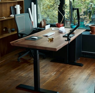 a desk with a laptop and a laptop on a wooden desk