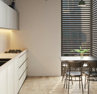 a kitchen with a table and chairs and a table