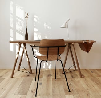 a desk with a wooden desk and a lamp