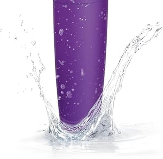 a purple philips electric shaver with a white background