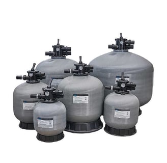 a group of large filtration tanks with valves