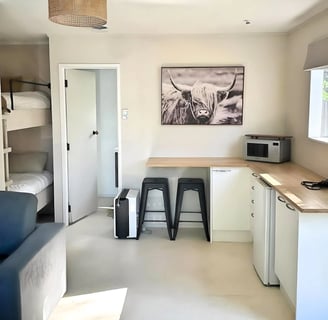 Room with bunks and kitchenette