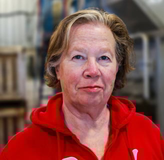 Rosemary Wotske Founder of Poplar Bluff Organics wearing red sweater
