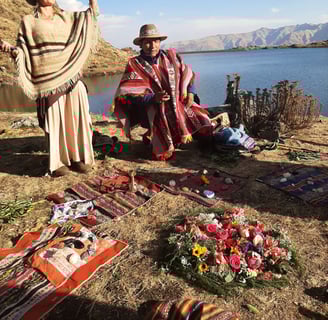 a medicine woman and a medicine man in a Despacho ceremony praying with the spirits of the mountain