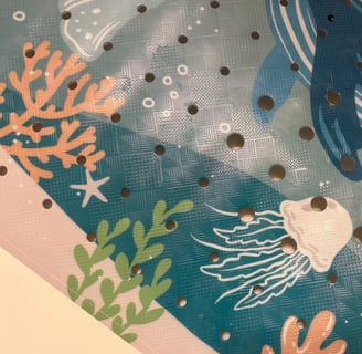 a picture of a bath tub mat with sea creatures on it