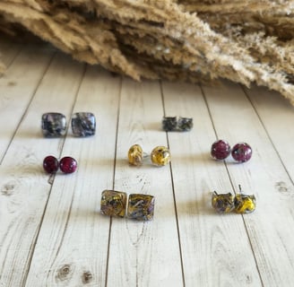 Handpicked wildflower petals encased in clear resin and made into beautiful small stud earrings. 