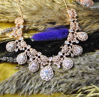 a necklace with a feather jewelry set