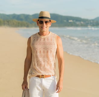 Rick Silvia wearing a sun hat on a beach in Thailand
