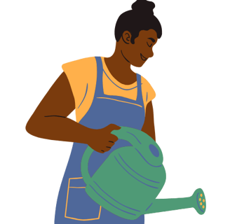 a woman in a blue apron is watering a potted plant