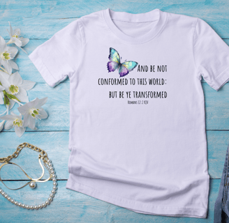 a t-shirt mockup. Background is a wood blue floor with flower and jewelry accents around the t-shirt