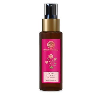 a bottle of body lotion with a pink rose on it