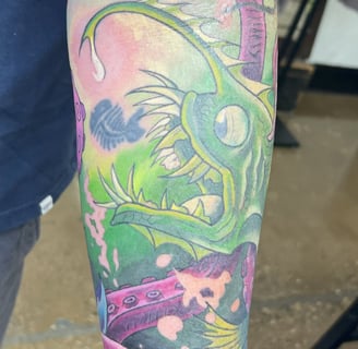 a man with a tattoo on his arm of a fish color tattoo