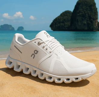 ON Men's Cloud 5 Sneakers on a beach with turquoise waters in the background