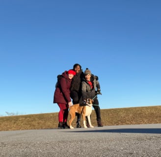 a group of people standing around a dog at Montvale Lookout