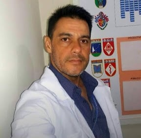 a man in a lab coat and a white lab coat