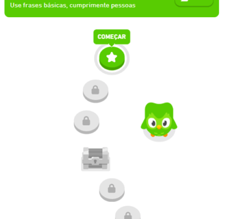 Duolingo screen showing learning path with green owl mascot.
