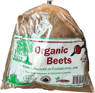 Clear plastic bag of beets with Poplar Bluff Organics logo