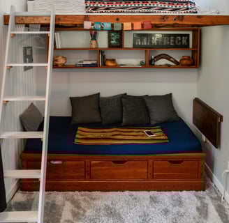 a lofted room with a lofted bed and a lofted bed