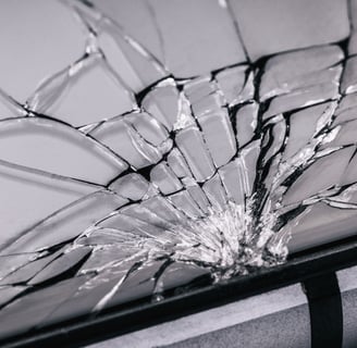 a broken cell phone screen showing a broken glass