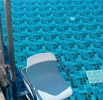 a chair that is sitting in front of a pool