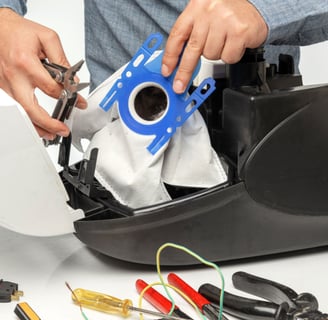 a man is holding a blue bag of tools