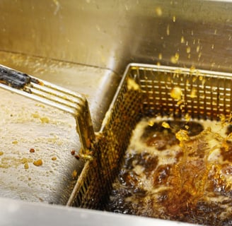 a fryer with a spatulable in it