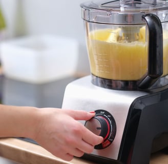 a person is making a juicer in a blender