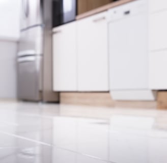 a mouse mouse on the floor of a kitchen