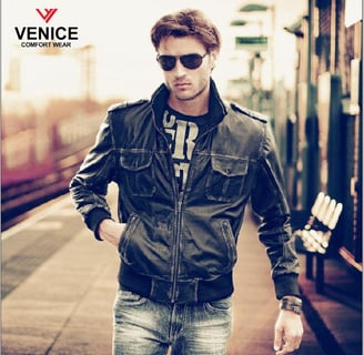 a man in a leather jacket and sunglasses