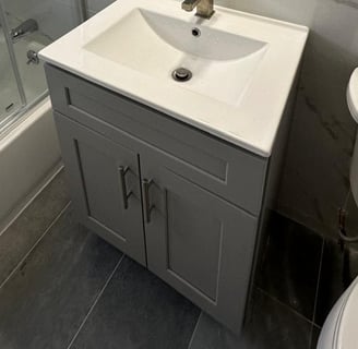 a bathroom with a sink and a shower