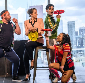 A trio of colourfully dressed frisbee athletes surround a female business executive