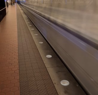 Washington metro subway station with a train leaving the station