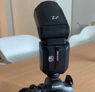 a camera flasher on a table with a flasher
