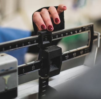 a woman with a scale