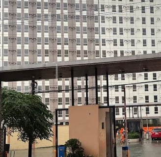 a city street scene with a car parked in front of a building
