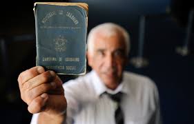 a man holding a passport and a passport case