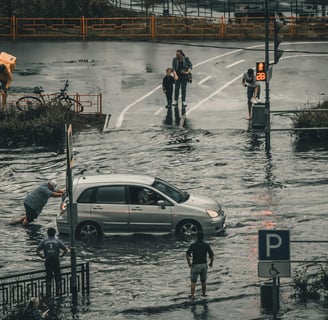 a car is parked in a flooded street