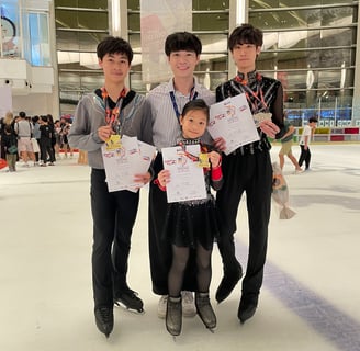 a group of people standing around a child's hand holding up their certificates