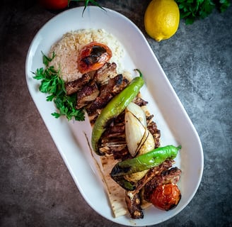 a plate of food with meat and vegetables