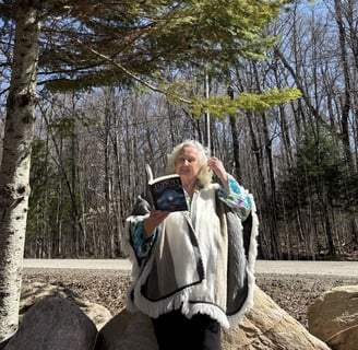 Tammie Whalen Buckler holding book, "Echoes Between Realms"