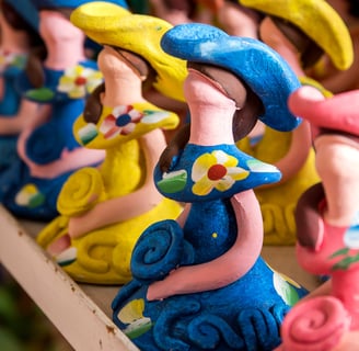 Muñecas Limé faceless dolls from the Dominican Republic, colorful handmade ceramic souvenirs