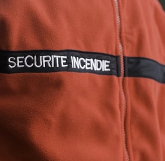 a security officer in uniform uniform with a security badge on the back of a man
